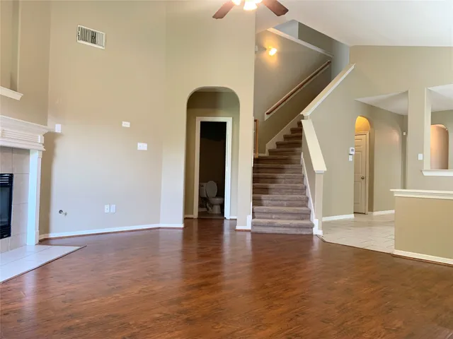 wooden floor in an empty room with glass door