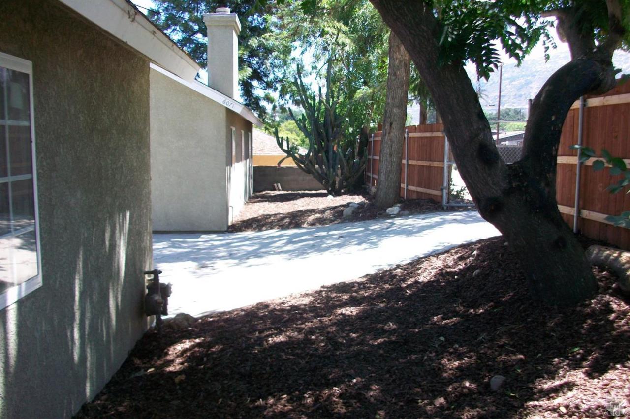 6071 Oak Knolls Road Simi Valley, CA 93063 - Photo 14 of 18 a view of a backyard of the house