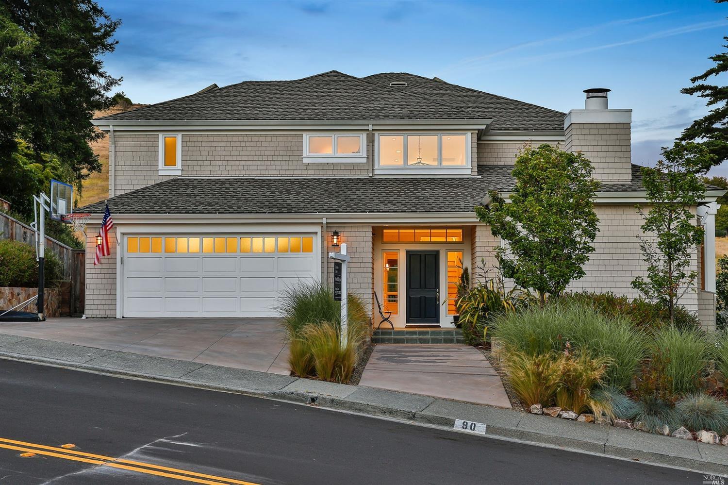 90 Reed Ranch Road Tiburon, CA 94920 - Photo 1 of 1 a view of a house with a small yard plants and a large tree