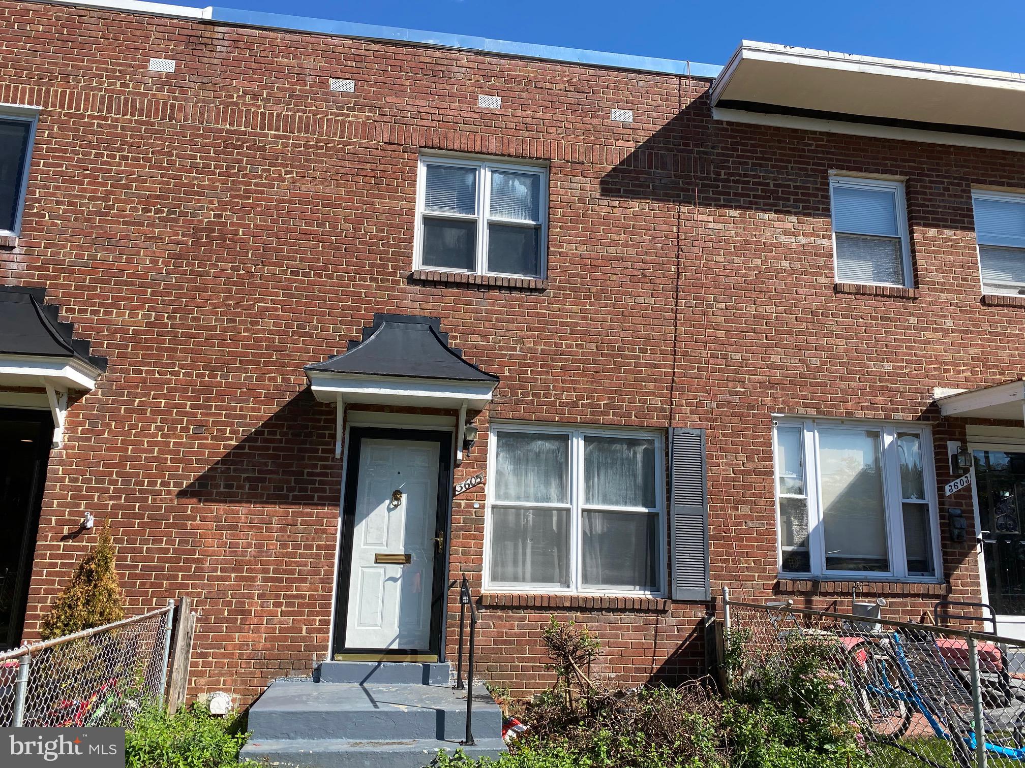 a front view of a house with glass windows