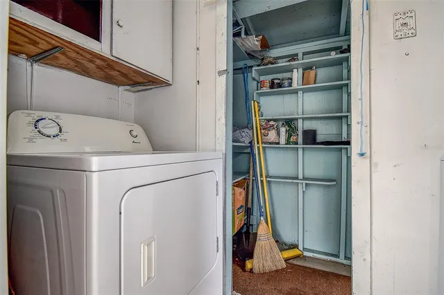 a view of house with backyard outdoor seating area