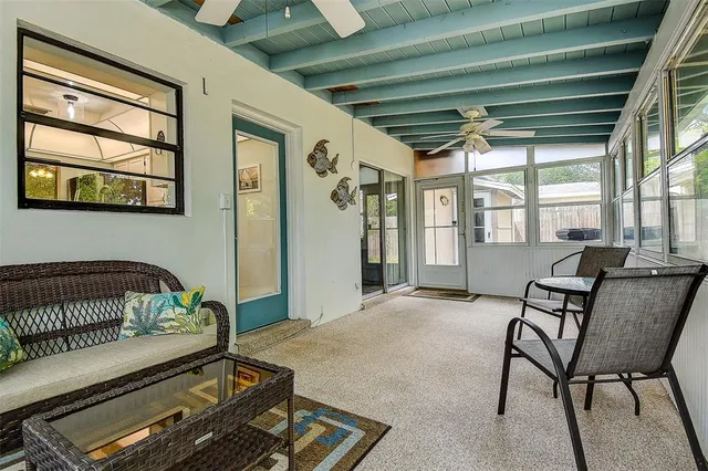 a living room with furniture and a window