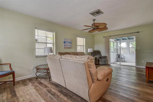 a living room with furniture and a window