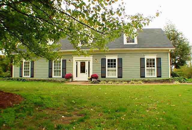 front view of a house with a garden