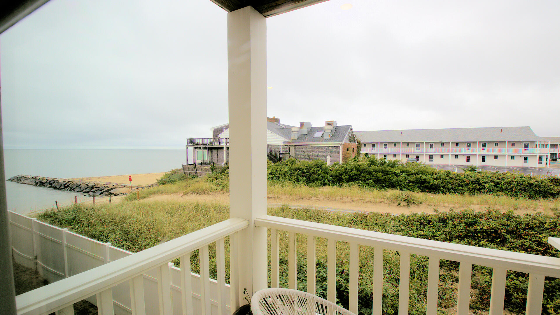 9 Chase Avenue, Unit U6 Dennis Port, MA 02639 - Photo 11 of 45 a view of a balcony with wooden floor and lake view