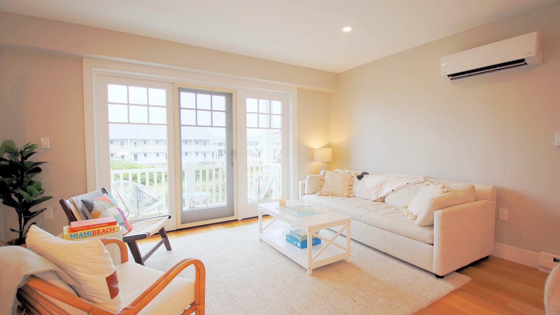 9 Chase Avenue, Unit U6 Dennis Port, MA 02639 - Photo 12 of 45 a living room with furniture and floor to ceiling windows