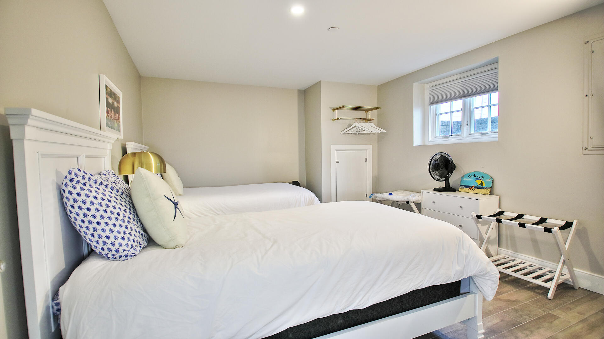 9 Chase Avenue, Unit U6 Dennis Port, MA 02639 - Photo 39 of 45 a bedroom with a bed and wooden floor