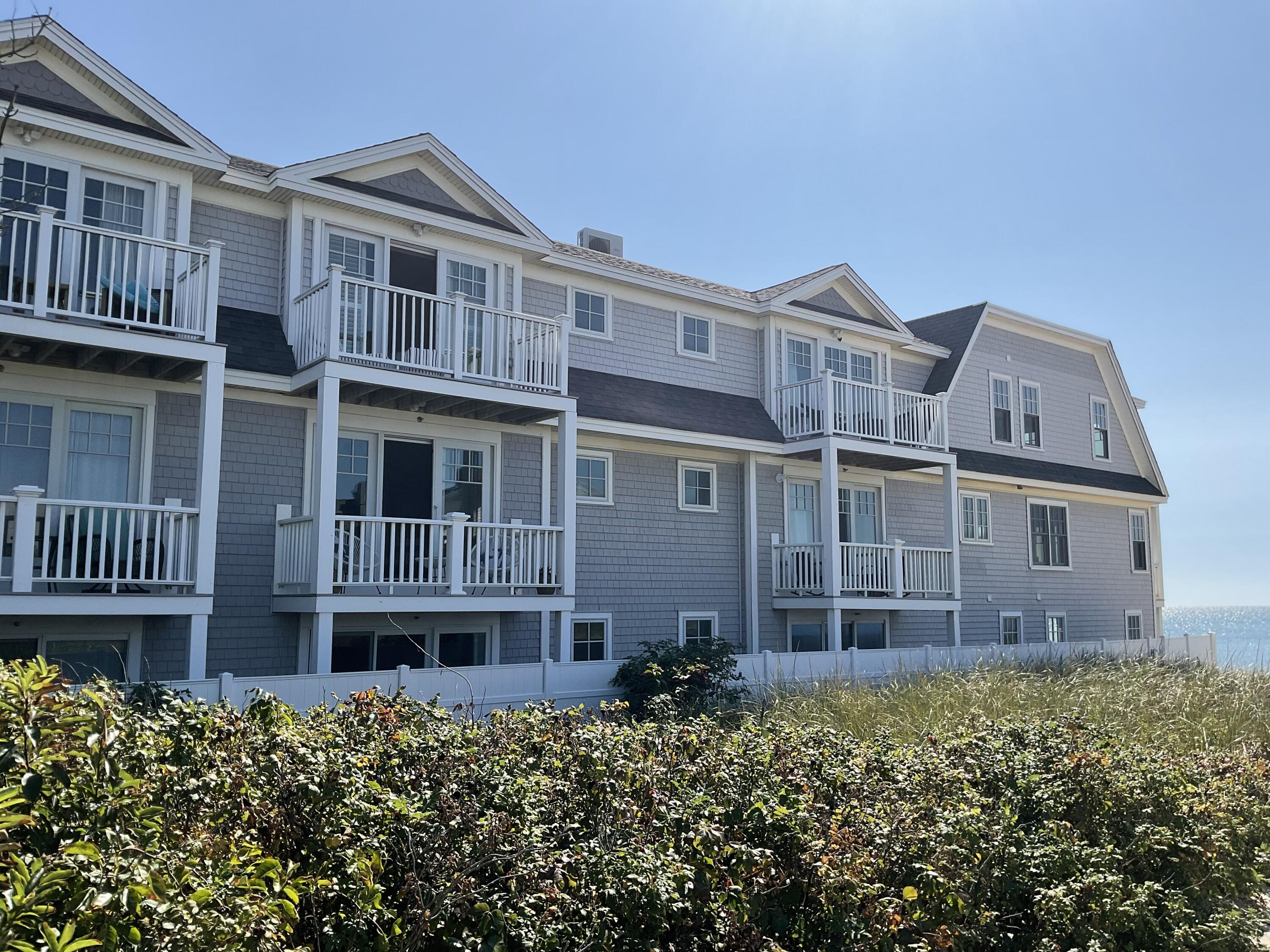 9 Chase Avenue, Unit U6 Dennis Port, MA 02639 - Photo 4 of 45 a view of a brick building next to a yard