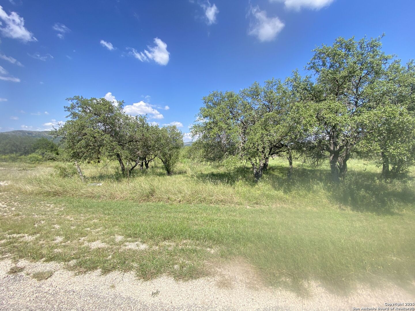 0 Mockingbird Lane Camp Wood, TX 78833 - Photo 8 of 16 a view of a lake from a yard