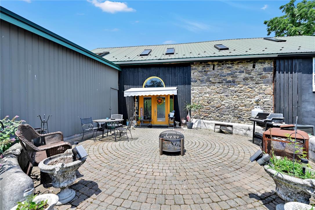 101 Conrad Road Fleetwood, PA 19522 - Photo 24 of 42 A quaint paved patio offers a peaceful outdoor setting for relaxation and entertainment.