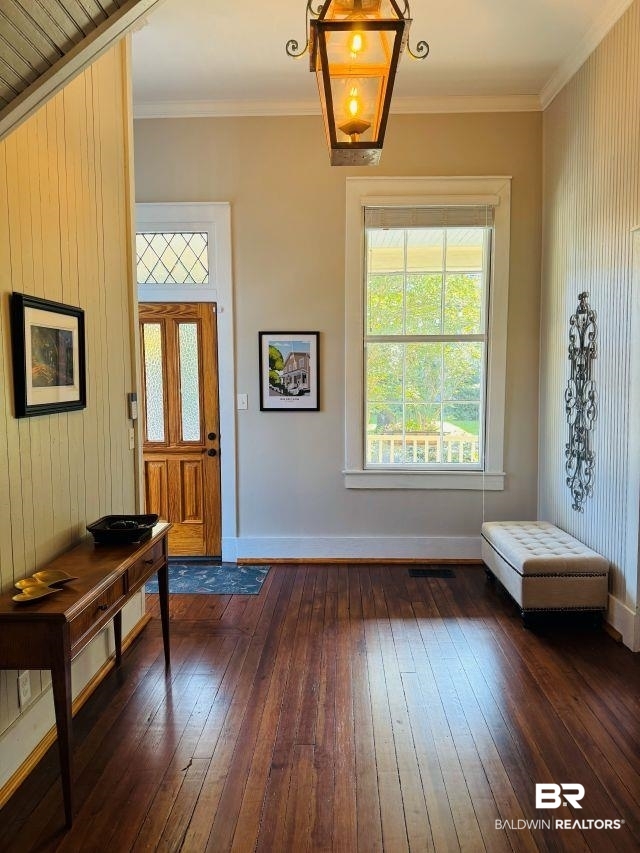 54 South Catherine Street Mobile, AL 36604 - Photo 9 of 55 Foyer boasts beautiful front door, decorative glass transom, attractive ornamental molding, and handsomely finished wood floors