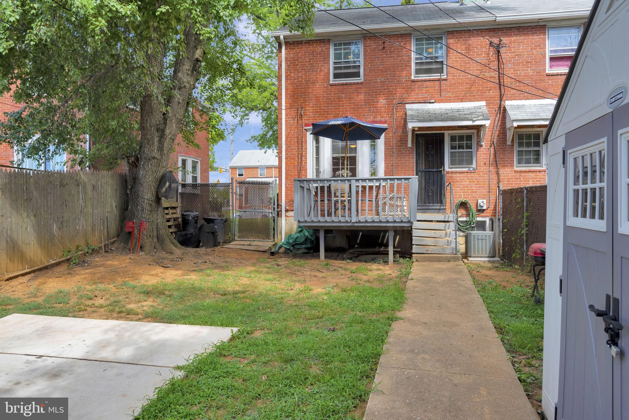 4019 Brookhill Road Baltimore, MD 21215 - Photo 14 of 15 Back yard with parking pad and deck