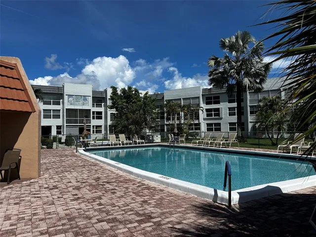 a view of a house with swimming pool