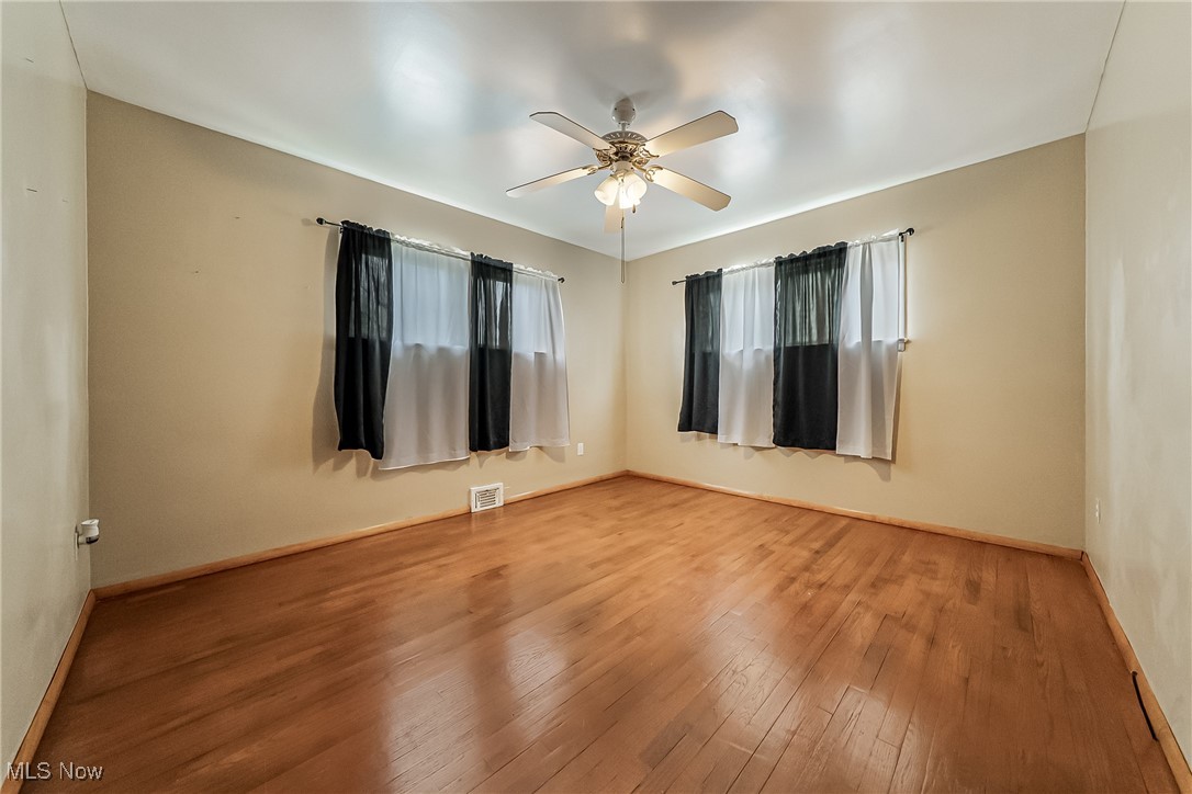 20620 Donnybrook Road Maple Heights, OH 44137 - Photo 14 of 32 Spare room with wood-type flooring and ceiling fan