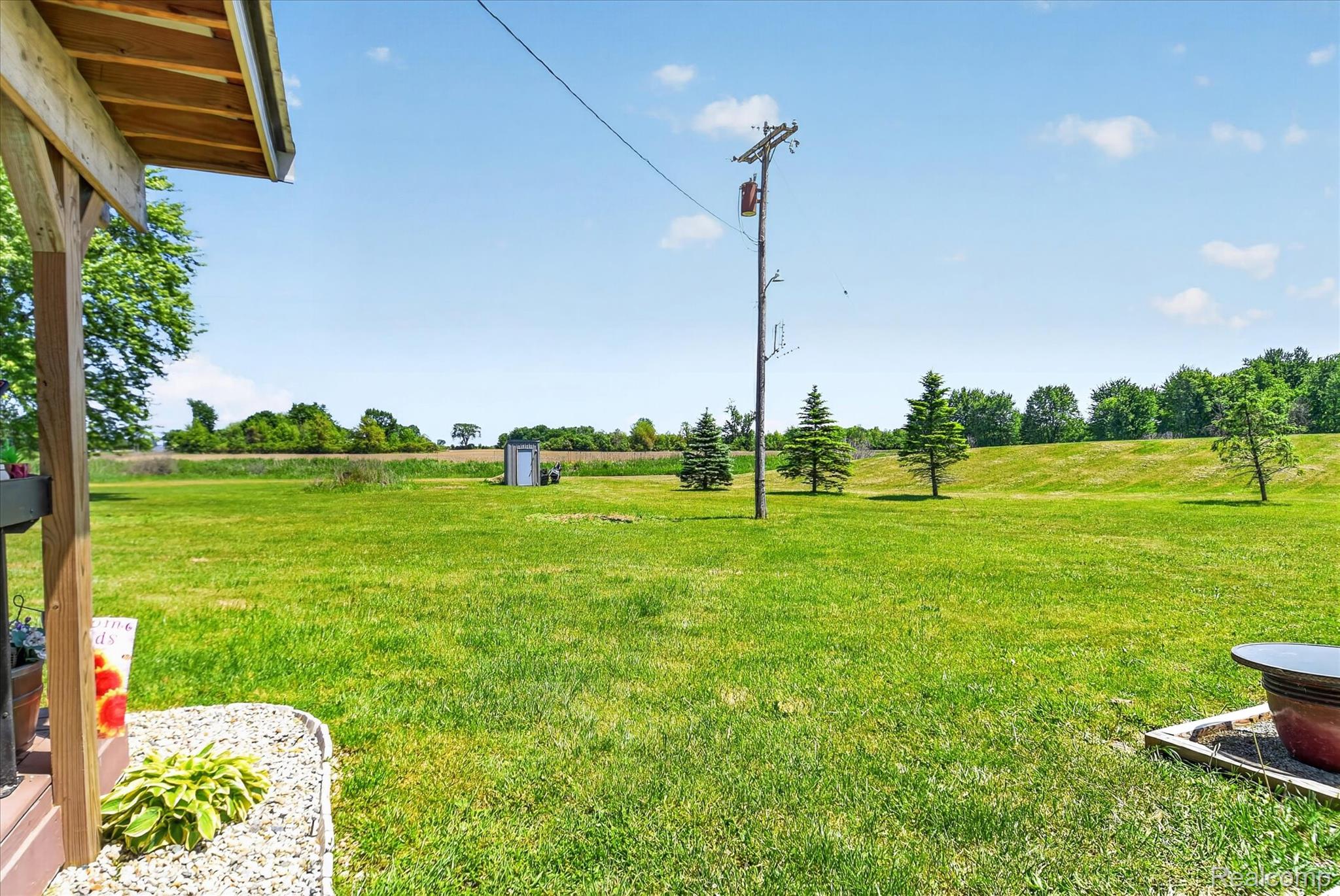 3949 West Burns Line Road Brown City, MI 48416 - Photo 64 of 70 Expansive green space featuring a large lawn area and mature trees