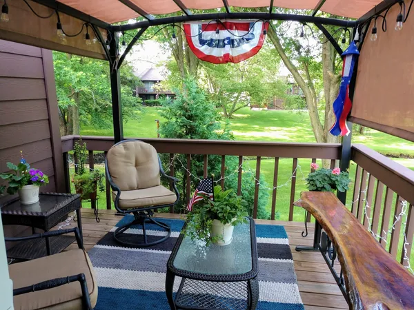 a view of balcony with furniture