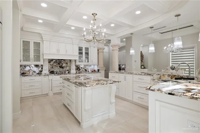 a kitchen with kitchen island white cabinets and appliances