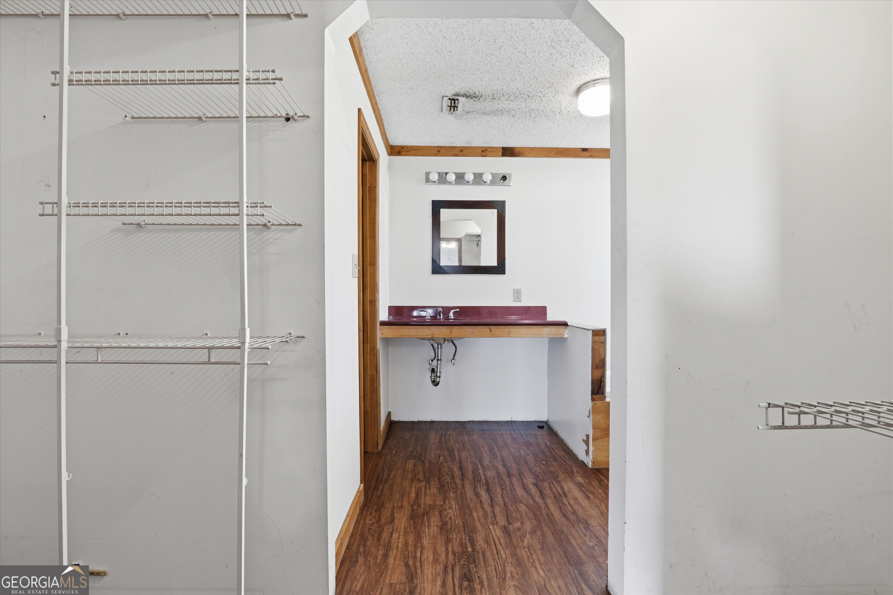 1525 Myron Hart Road Coolidge, GA 31738 - Photo 20 of 58 a view of walk in closet with wooden floor