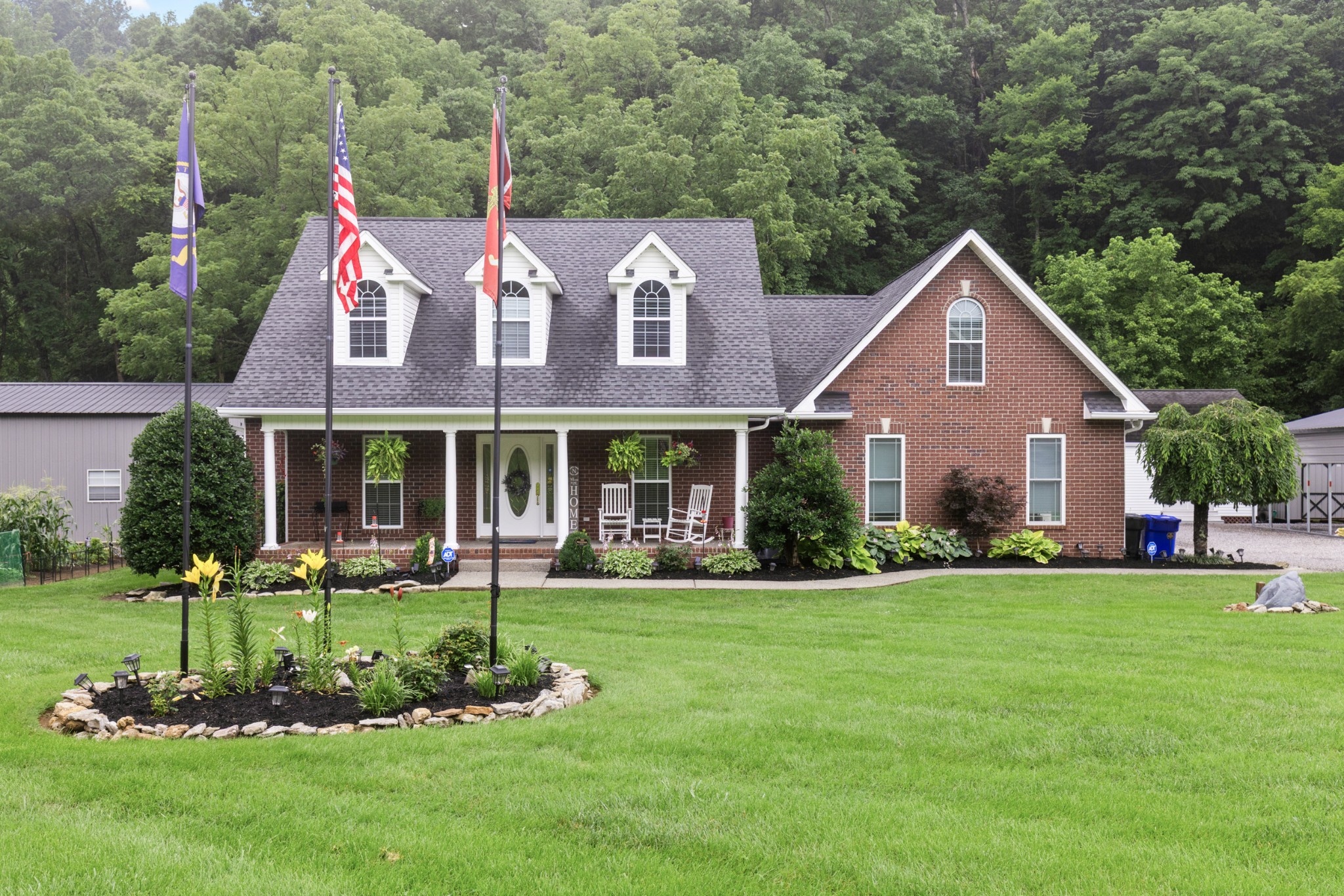 454 Campbell Hollow Road Bethpage, TN 37022 - Photo 3 of 57 a front view of a house with a yard table and chairs