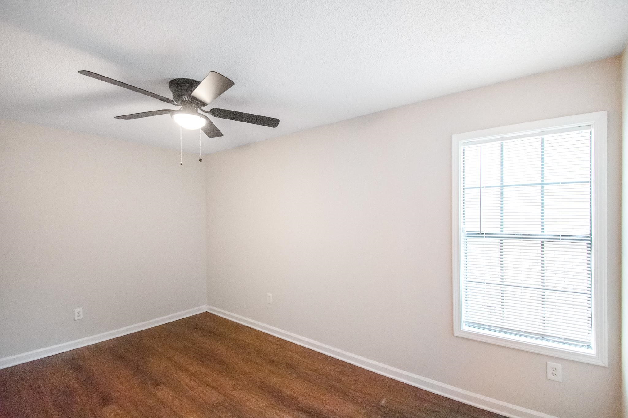 4775 Allrand Road Memphis, TN 38118 - Photo 15 of 21 an empty room with a window and a fan