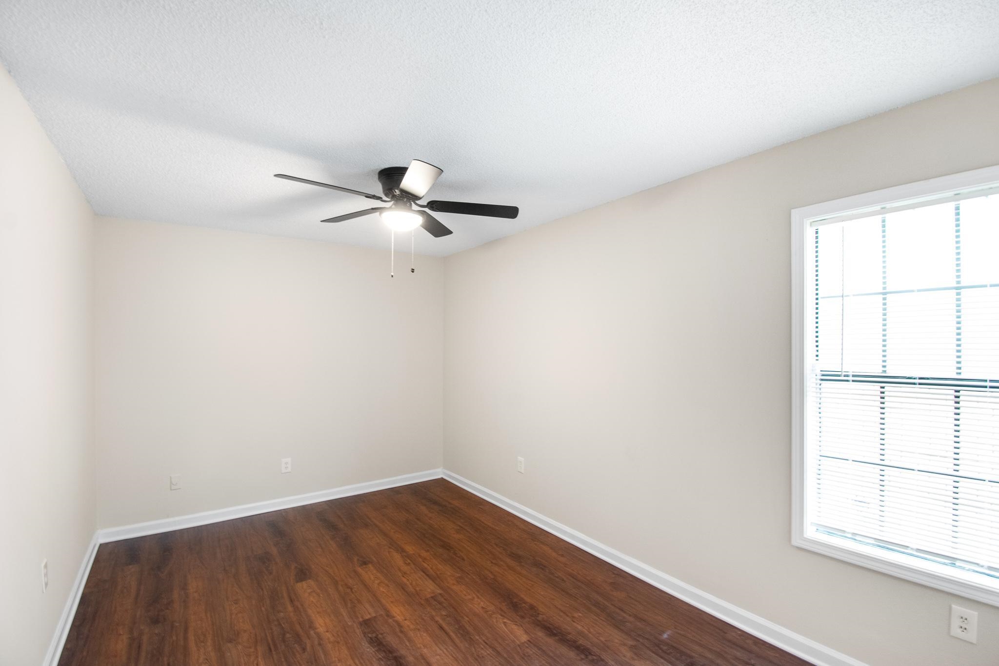 4775 Allrand Road Memphis, TN 38118 - Photo 20 of 21 wooden floor in an empty room with a window
