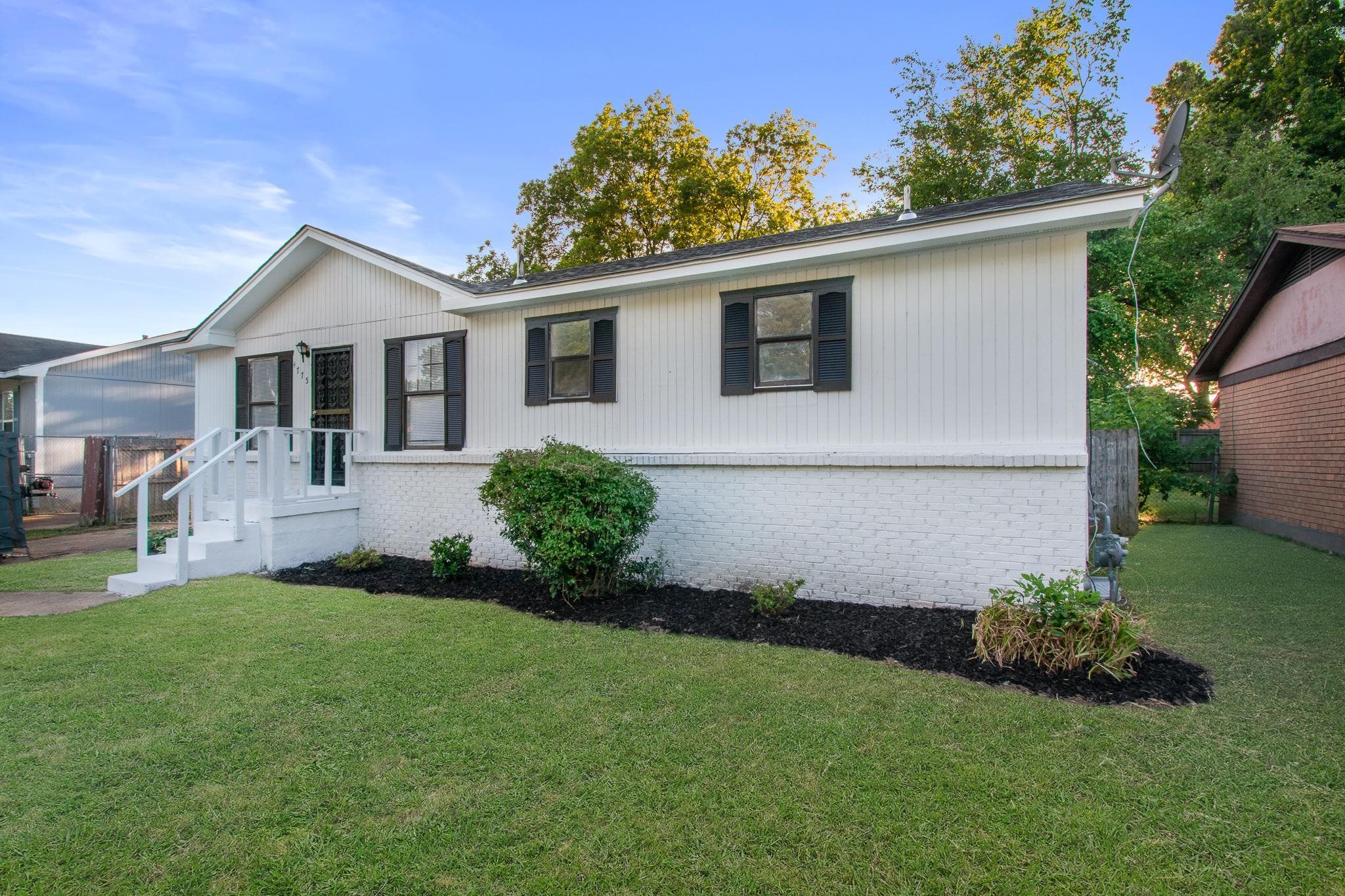 4775 Allrand Road Memphis, TN 38118 - Photo 2 of 21 a front view of house with yard and green space