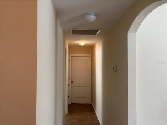 a view of a bathroom from a hallway