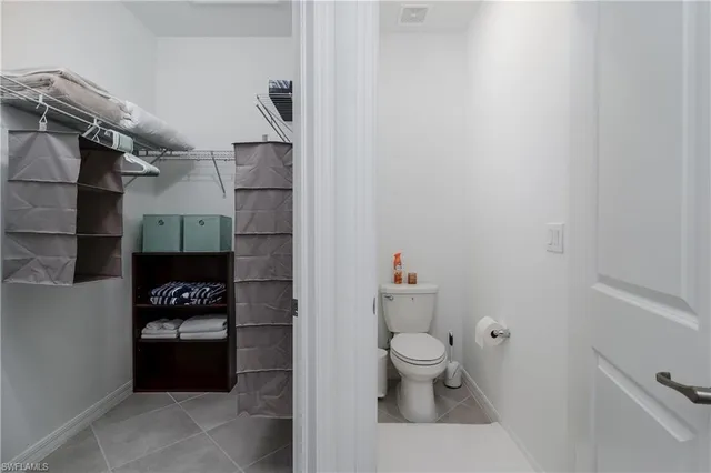 a bathroom with a toilet and shower