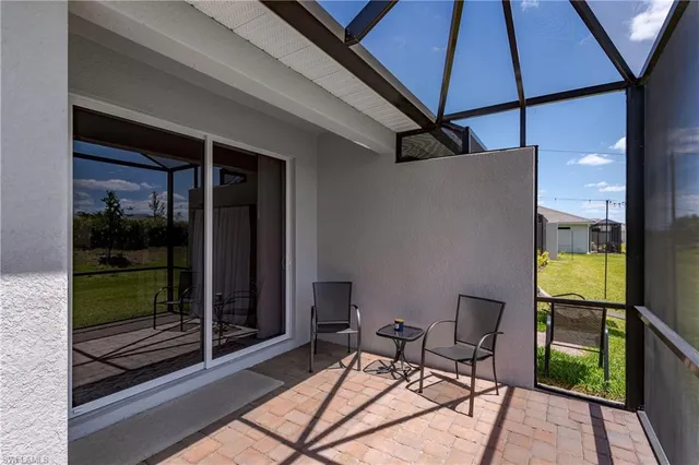 a balcony with table and chairs