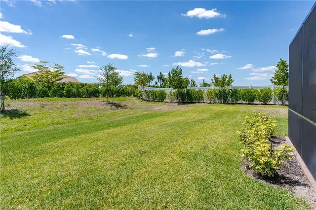 a view of an outdoor space and basketball court