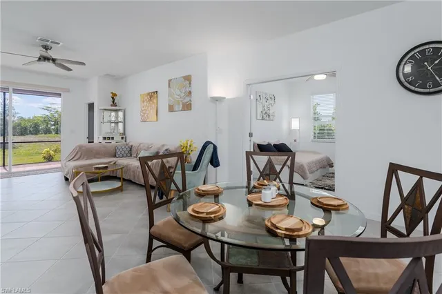 a view of a dining room with furniture and a table