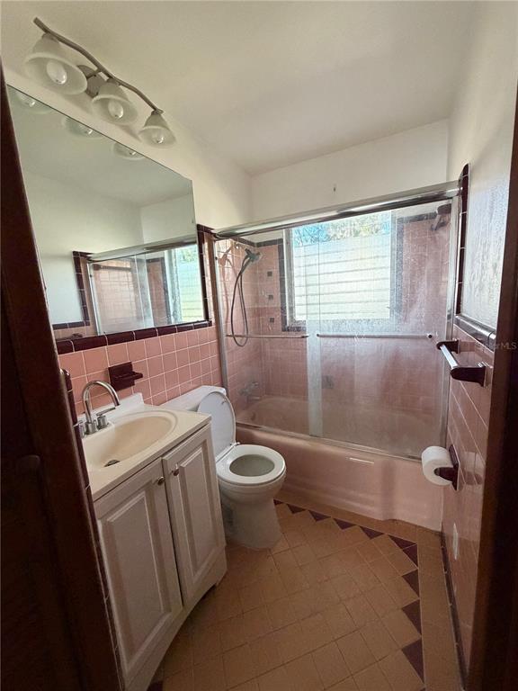 6131 Lafayette Street New Port Richey, FL 34652 - Photo 13 of 34 a bathroom with a granite countertop sink toilet and shower