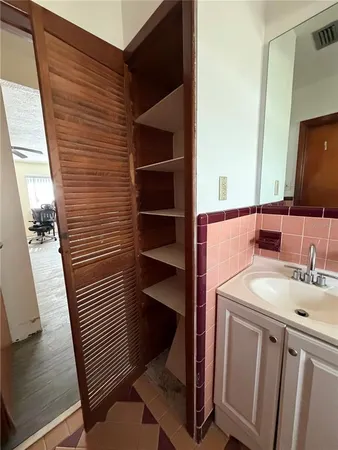 a bathroom with a sink and a mirror