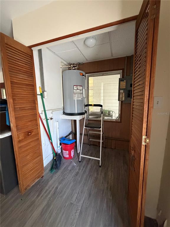 6131 Lafayette Street New Port Richey, FL 34652 - Photo 16 of 34 a utility room with wooden floor and windows