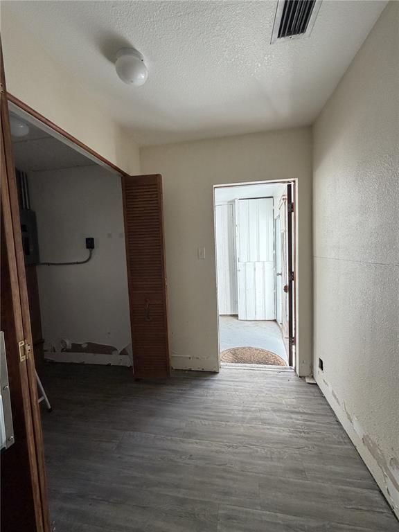 6131 Lafayette Street New Port Richey, FL 34652 - Photo 21 of 34 an empty room with wooden floor and windows