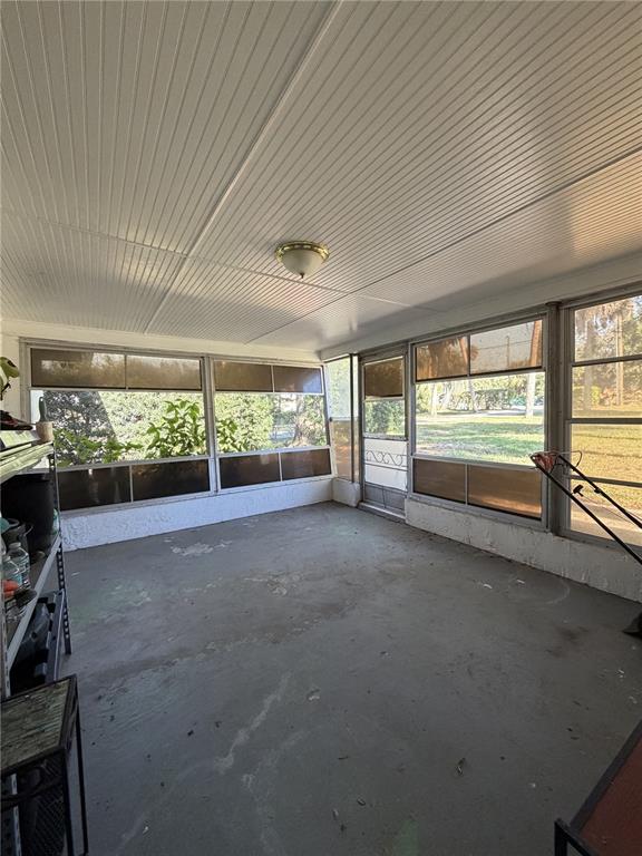 6131 Lafayette Street New Port Richey, FL 34652 - Photo 22 of 34 a view of room with furniture and floor to ceiling window