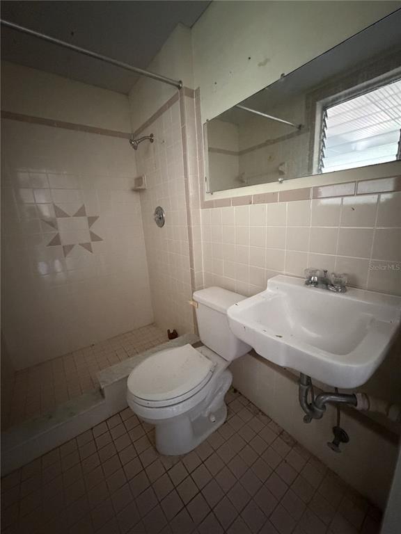 6131 Lafayette Street New Port Richey, FL 34652 - Photo 24 of 34 a bathroom with a sink toilet and shower