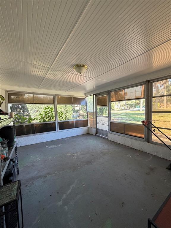 6131 Lafayette Street New Port Richey, FL 34652 - Photo 3 of 34 a view of room with furniture and floor to ceiling window