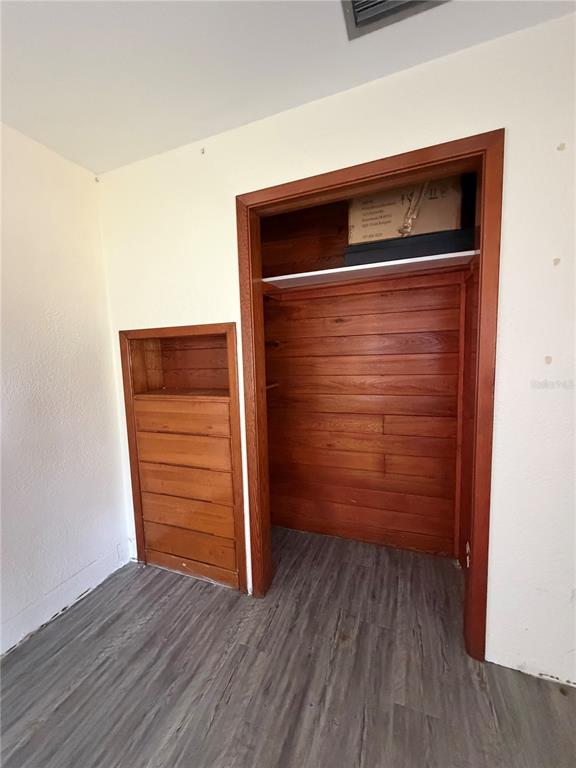 6131 Lafayette Street New Port Richey, FL 34652 - Photo 9 of 34 a view of walk in closet with empty racks