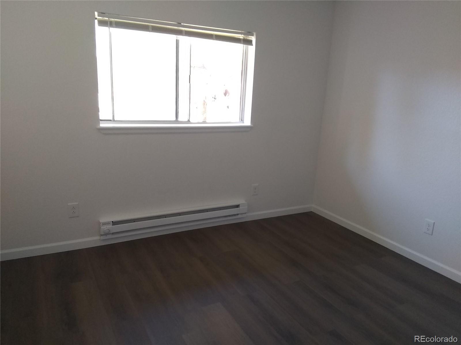 Undisclosed Address Aurora, CO 80011 - Photo 12 of 14 an empty room with a window
