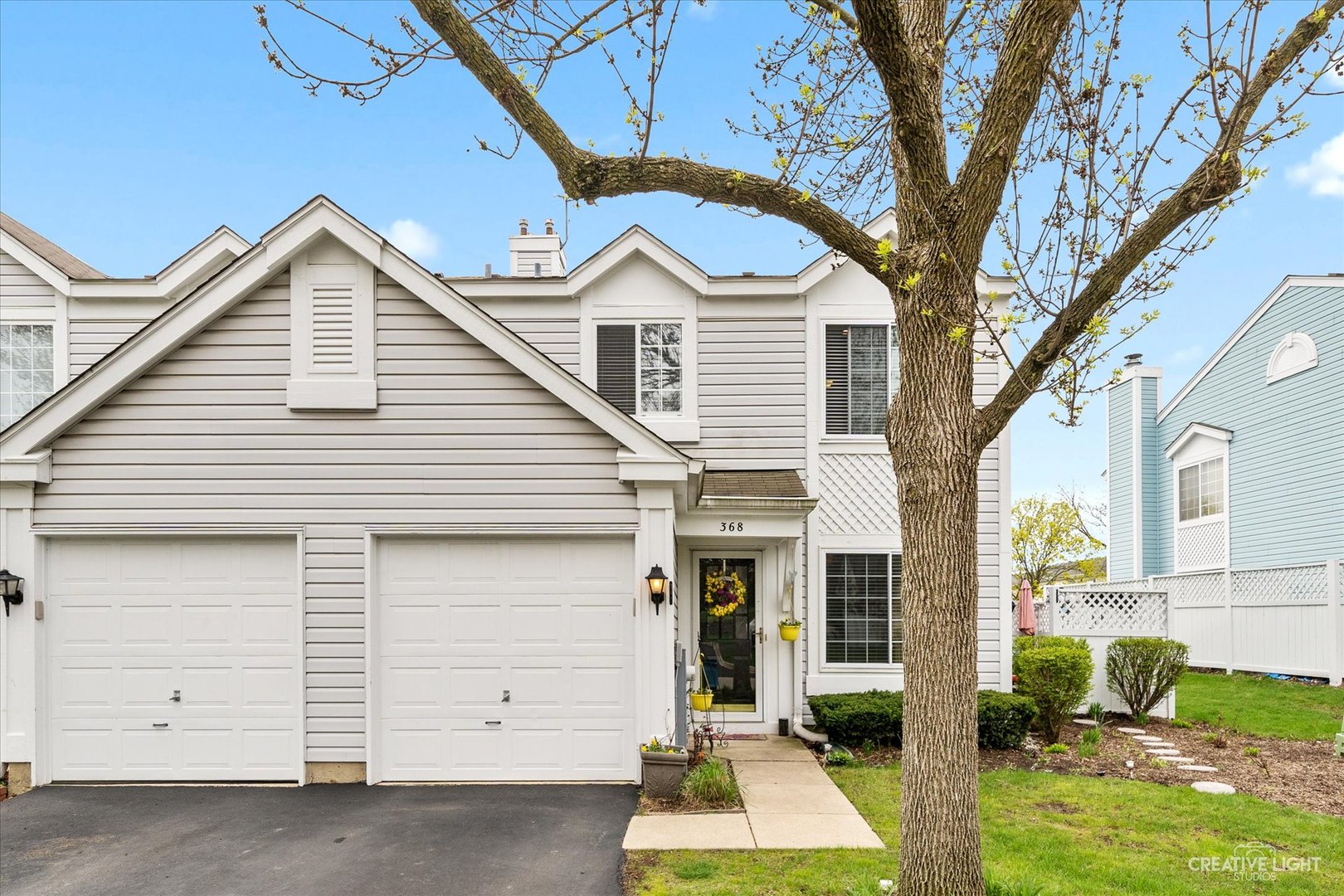 a view of a house with a yard and garage