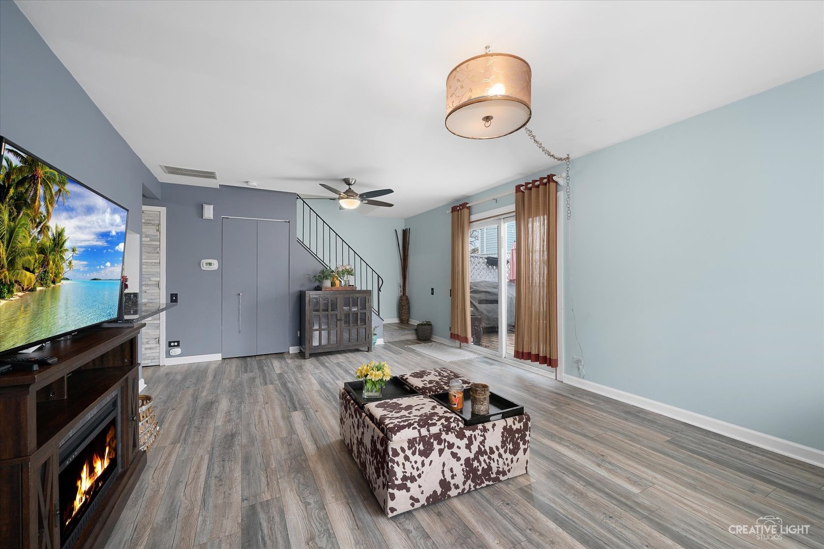 368 Bunker Hill Circle Aurora, IL 60504 - Photo 2 of 15 a living room with furniture and a flat screen tv