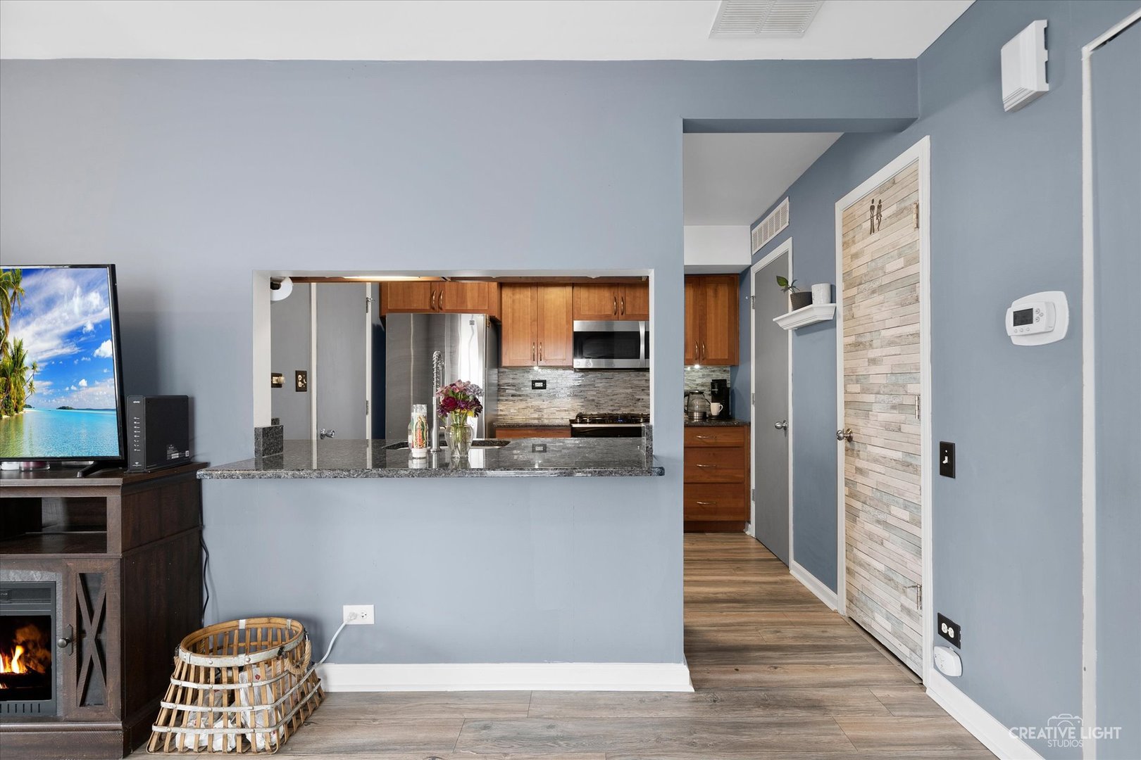 368 Bunker Hill Circle Aurora, IL 60504 - Photo 5 of 15 a view of a living room with furniture and a flat screen tv