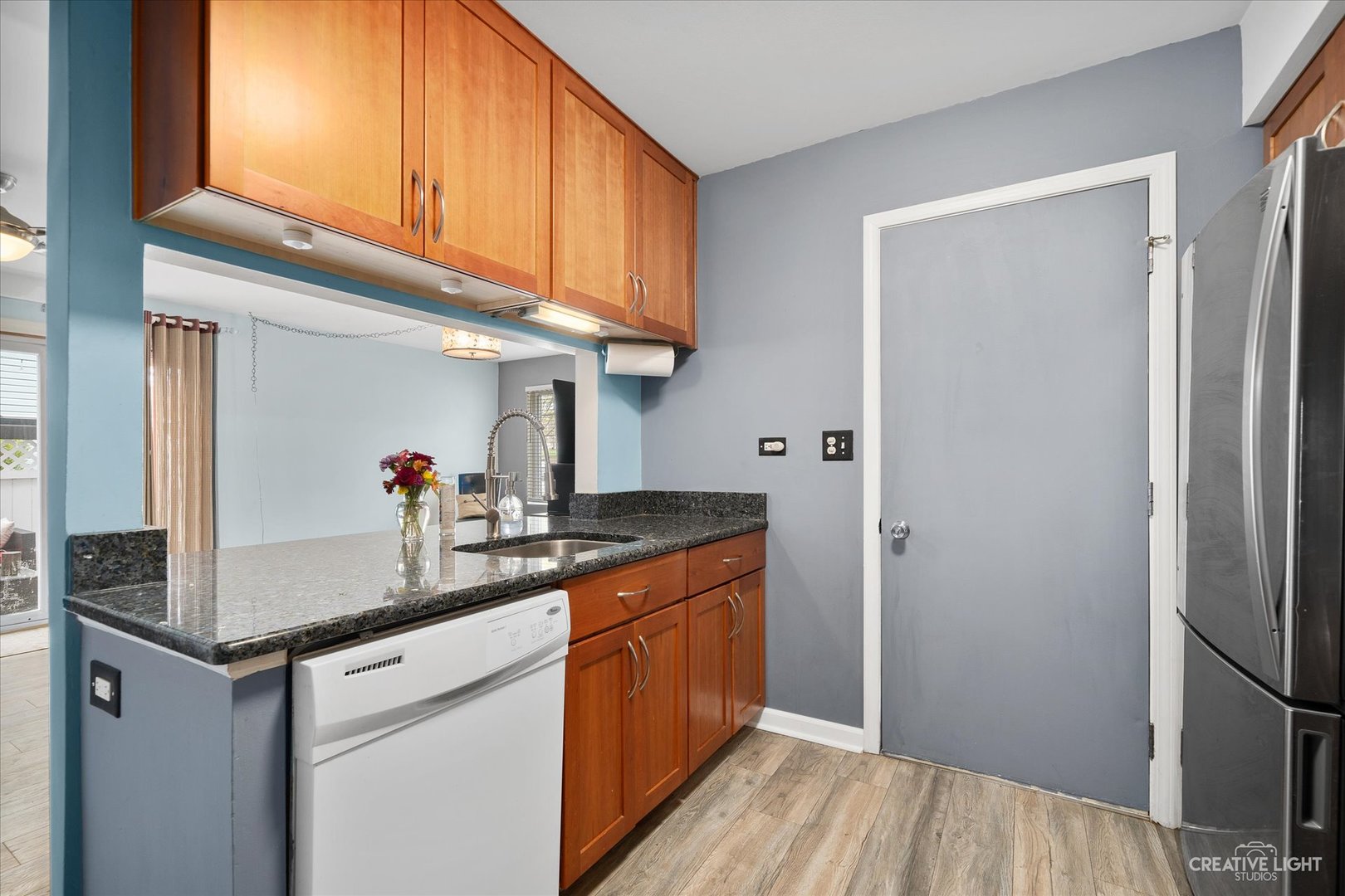 368 Bunker Hill Circle Aurora, IL 60504 - Photo 7 of 15 a kitchen with stainless steel appliances granite countertop a sink and cabinets