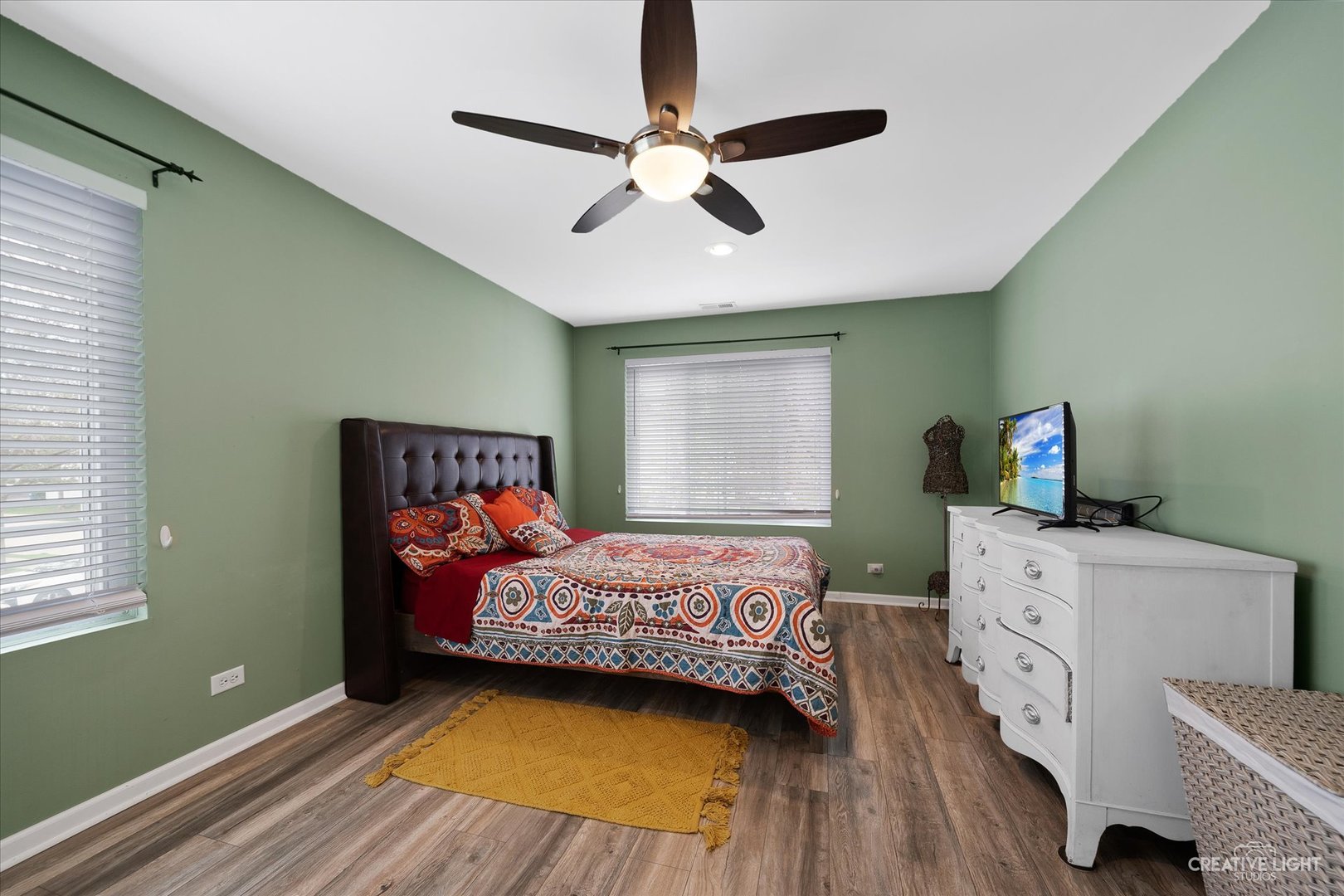 368 Bunker Hill Circle Aurora, IL 60504 - Photo 9 of 15 a bedroom with a bed and a ceiling fan