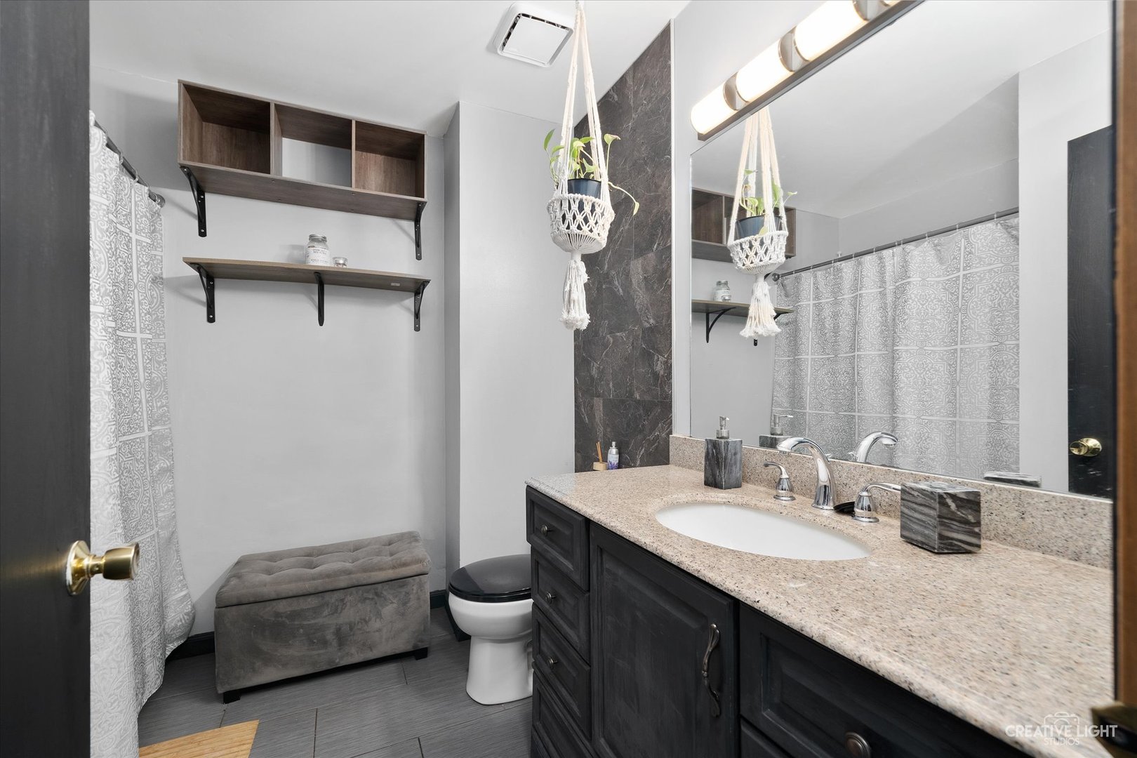 368 Bunker Hill Circle Aurora, IL 60504 - Photo 10 of 15 a bathroom with a granite countertop sink a toilet and shower