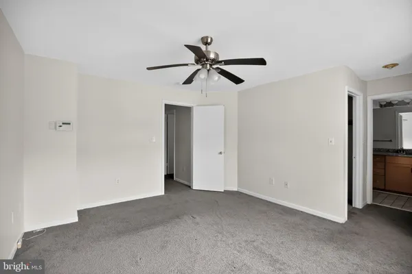 a view of a chandelier fan in a room