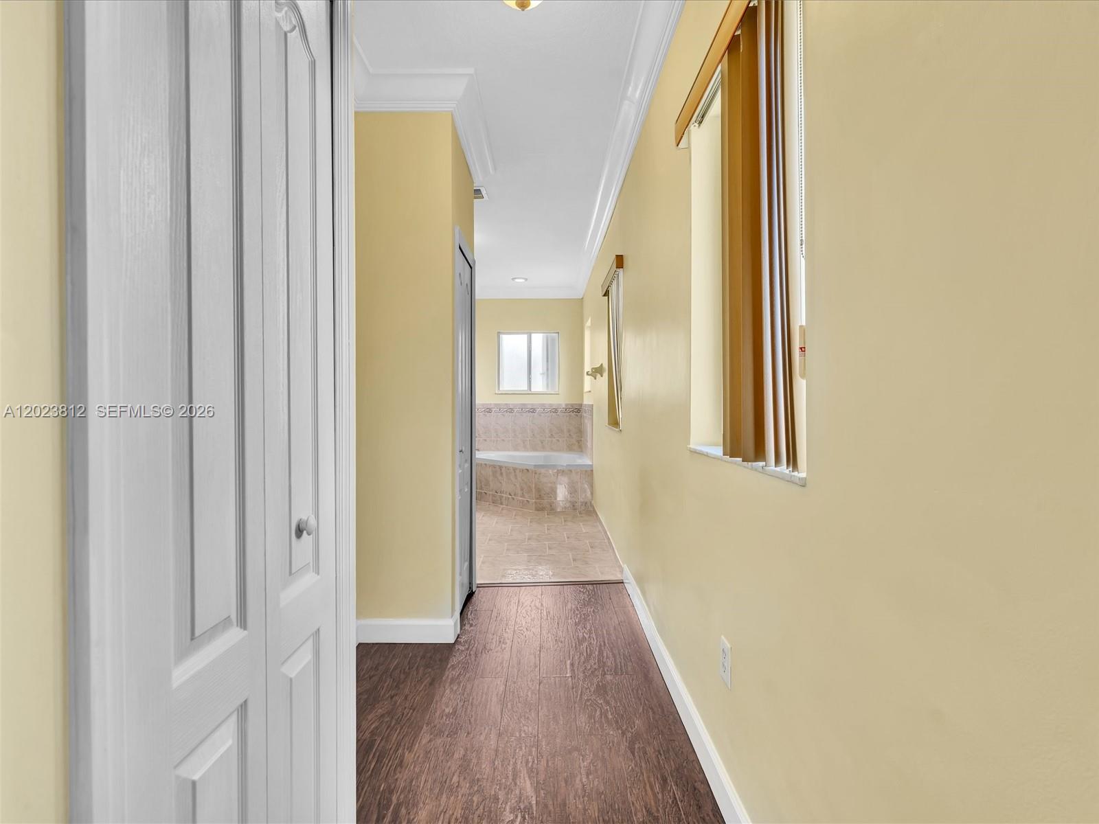 2864 Southwest 138th Path Miami, FL 33175 - Photo 21 of 40 a view of a hallway with wooden floor and glass door