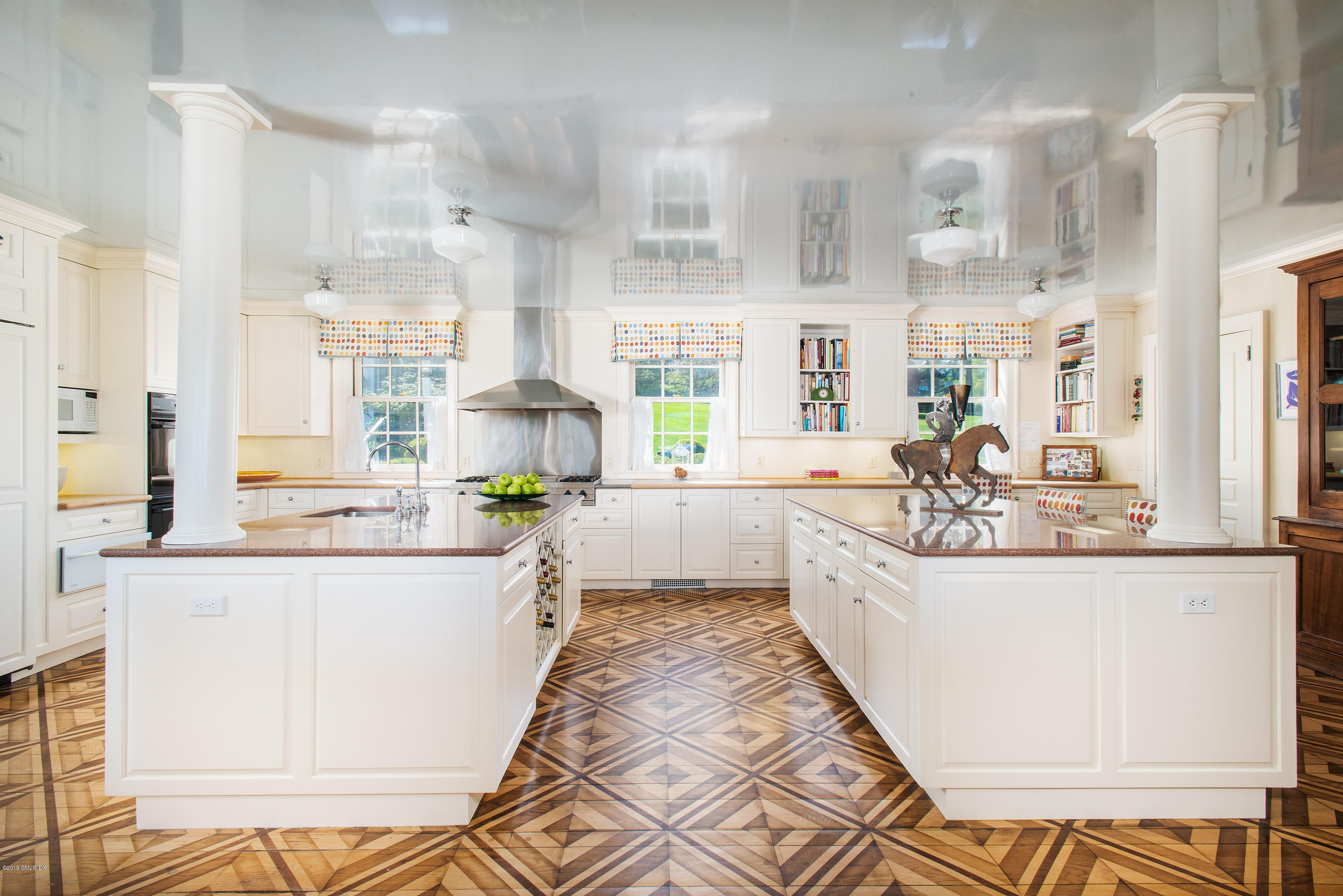 23 Smith Road Greenwich, CT 06830 - Photo 13 of 52 a large white kitchen with granite countertop a lot of counter space and a sink