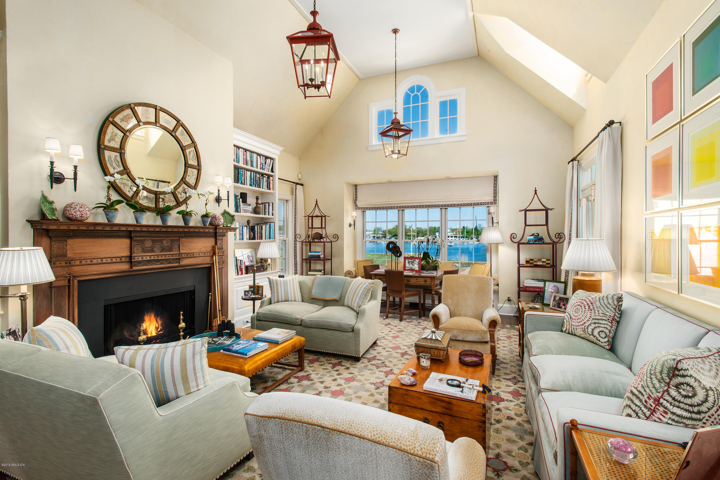 23 Smith Road Greenwich, CT 06830 - Photo 15 of 52 a living room with furniture a fireplace and a dining table